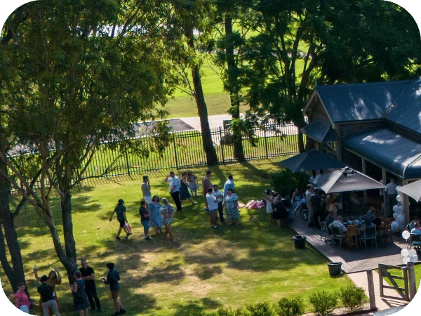 Guests gathered on the lawn beside Longs House